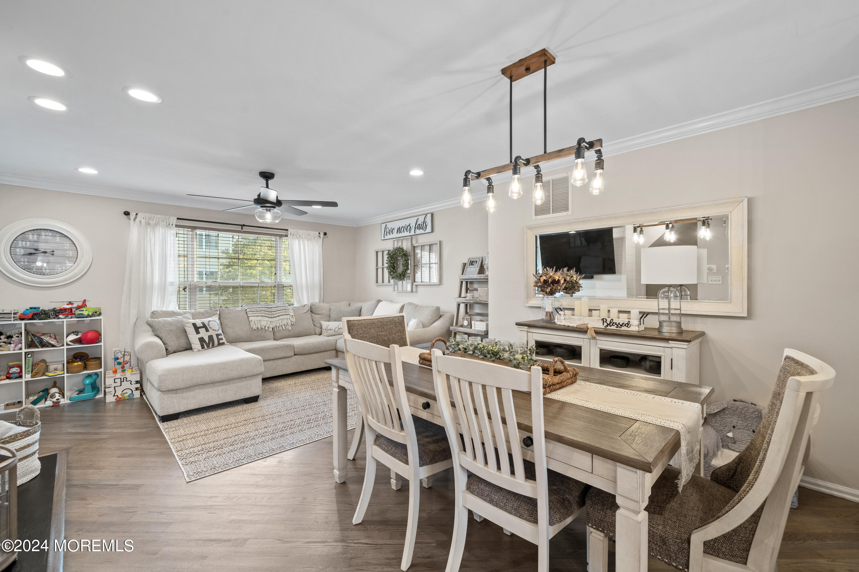 5 Kuczynski Drive, Unit 945 Parlin, NJ 08859 - Photo 14 of 62 a view of a dining room with furniture window and wooden floor