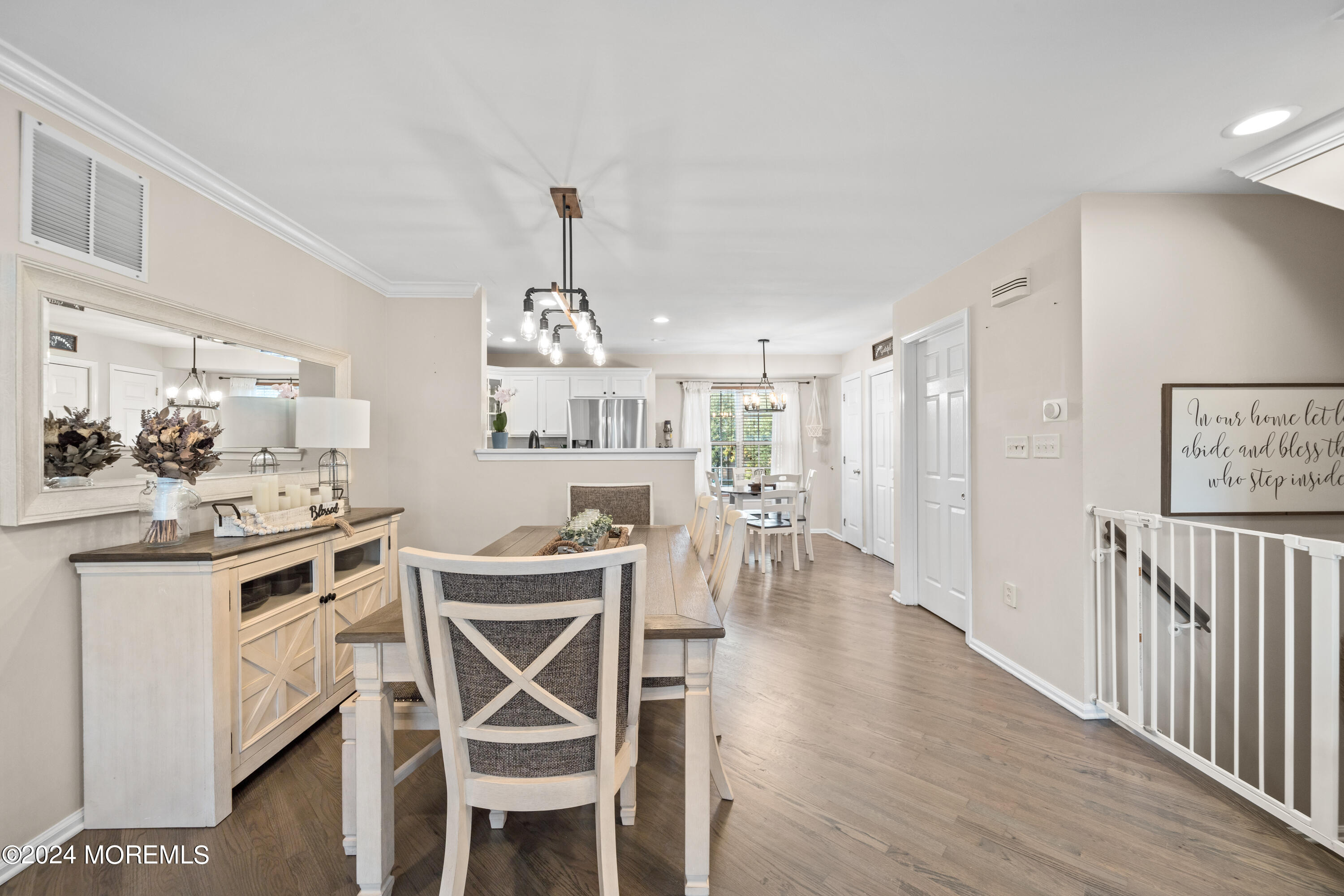 5 Kuczynski Drive, Unit 945 Parlin, NJ 08859 - Photo 16 of 62 a view of a dining room with furniture and wooden floor