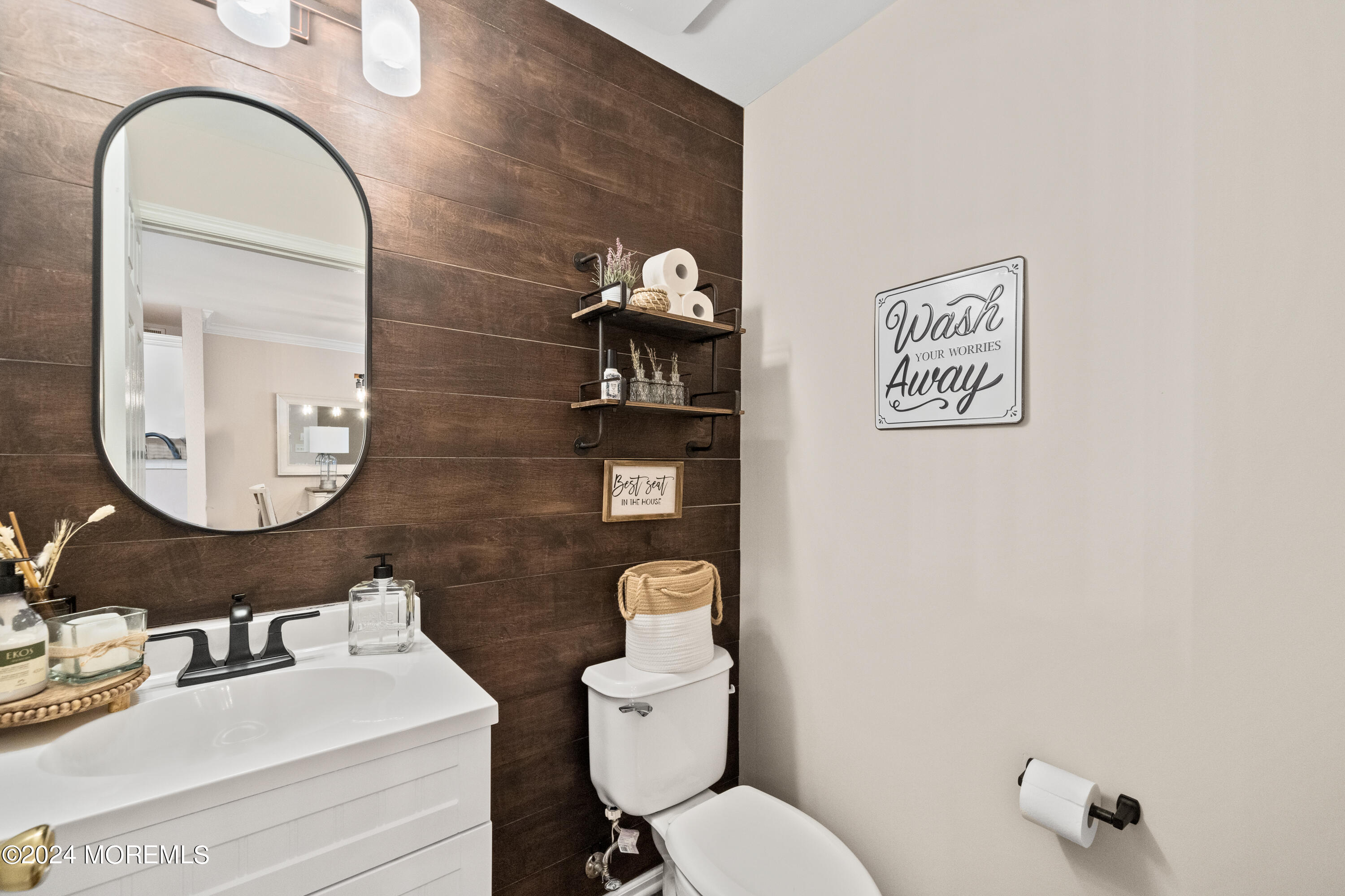 5 Kuczynski Drive, Unit 945 Parlin, NJ 08859 - Photo 21 of 62 a bathroom with a toilet a sink and mirror