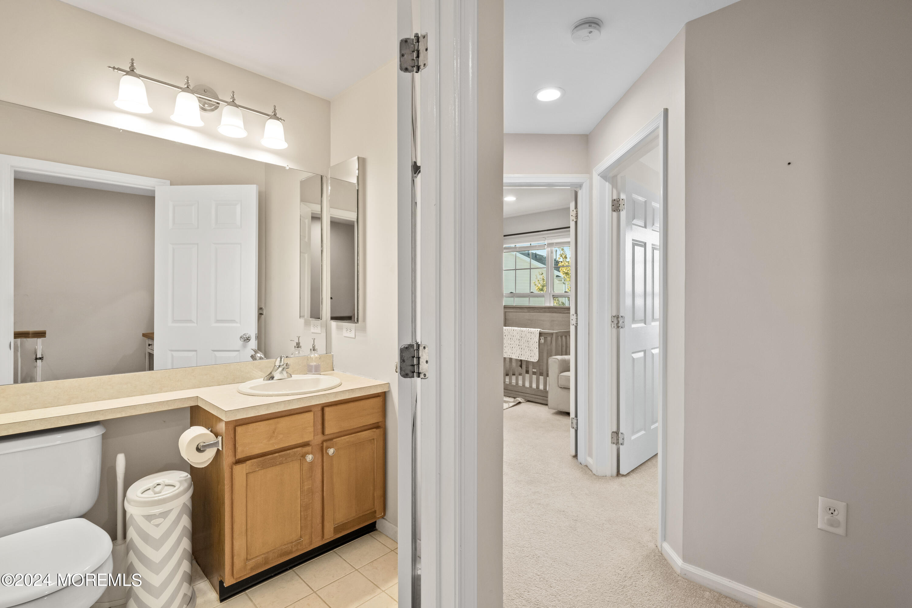 5 Kuczynski Drive, Unit 945 Parlin, NJ 08859 - Photo 23 of 62 a bathroom with a double vanity sink a mirror and a shower