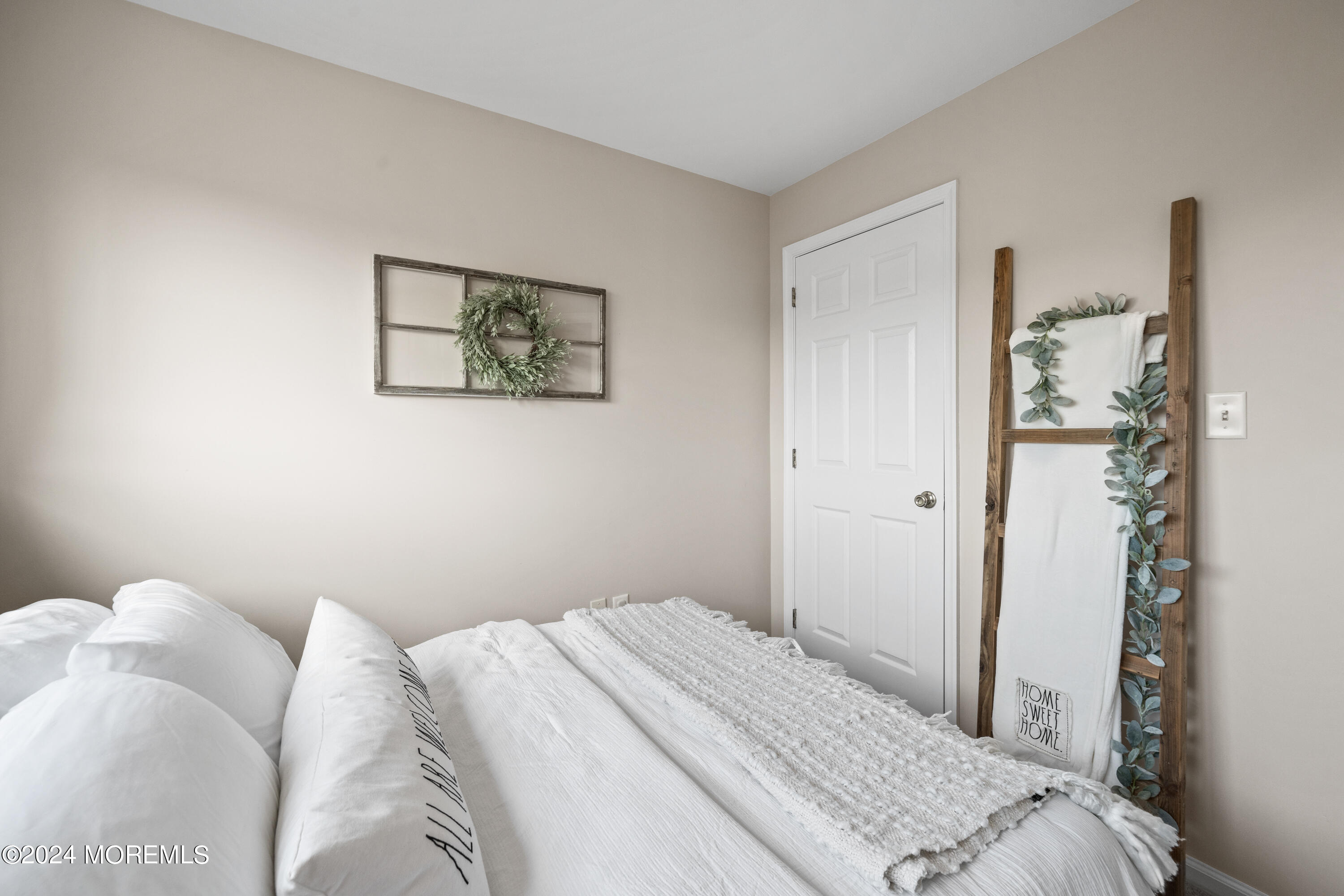 5 Kuczynski Drive, Unit 945 Parlin, NJ 08859 - Photo 26 of 62 a bedroom with a bed and hallway