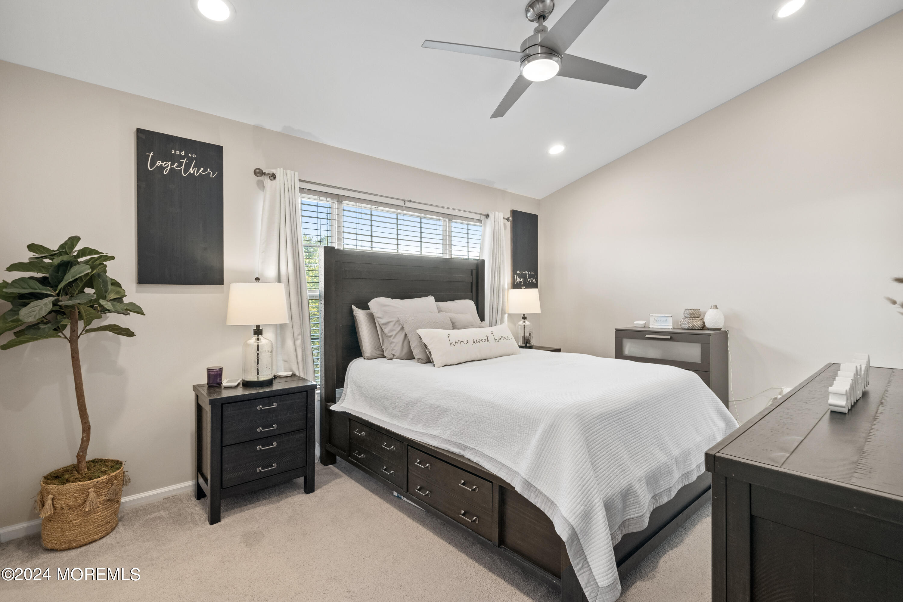 5 Kuczynski Drive, Unit 945 Parlin, NJ 08859 - Photo 30 of 62 a bedroom with a bed and a potted plant