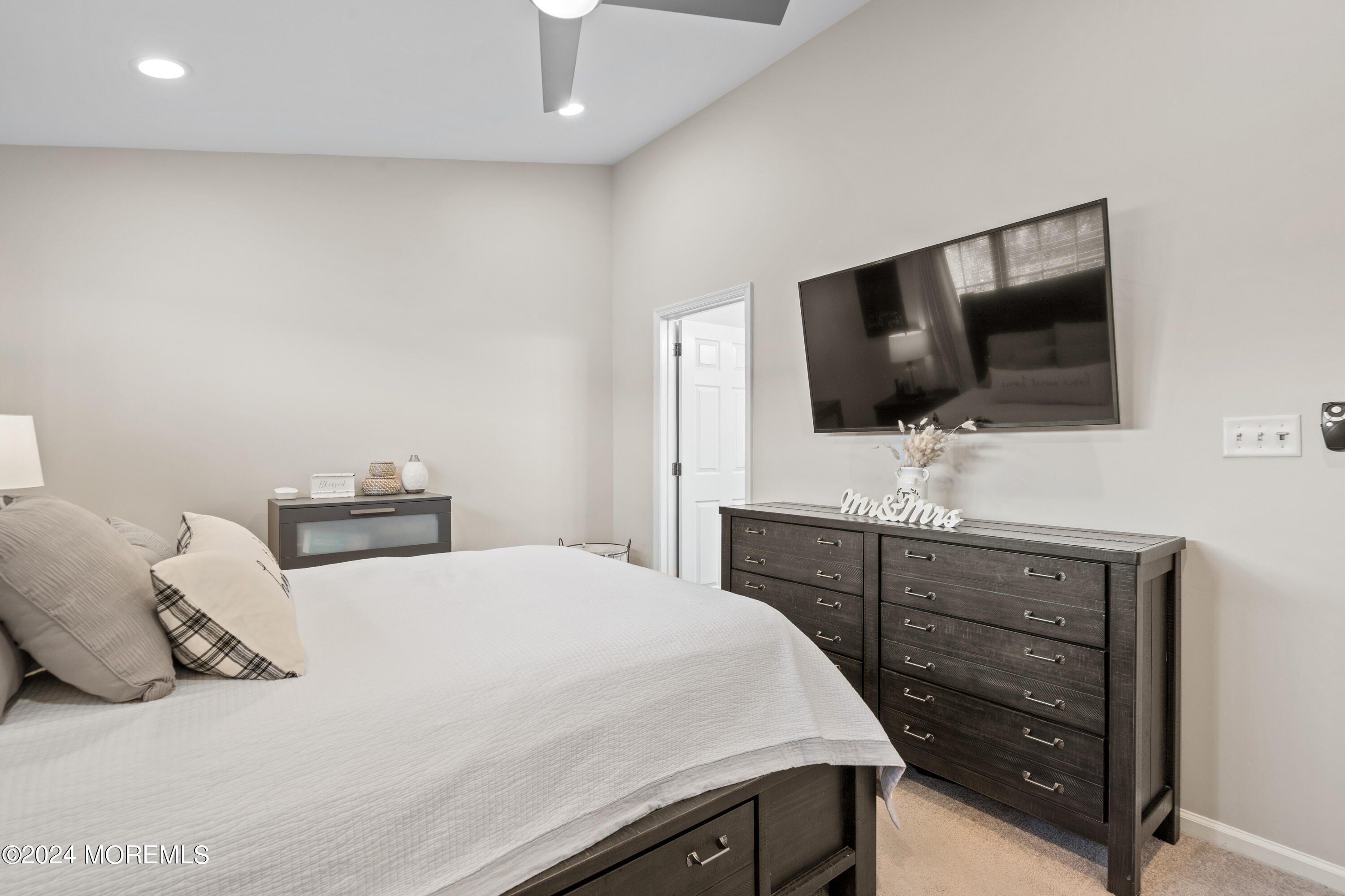 5 Kuczynski Drive, Unit 945 Parlin, NJ 08859 - Photo 32 of 62 a bedroom with a bed and a flat screen tv