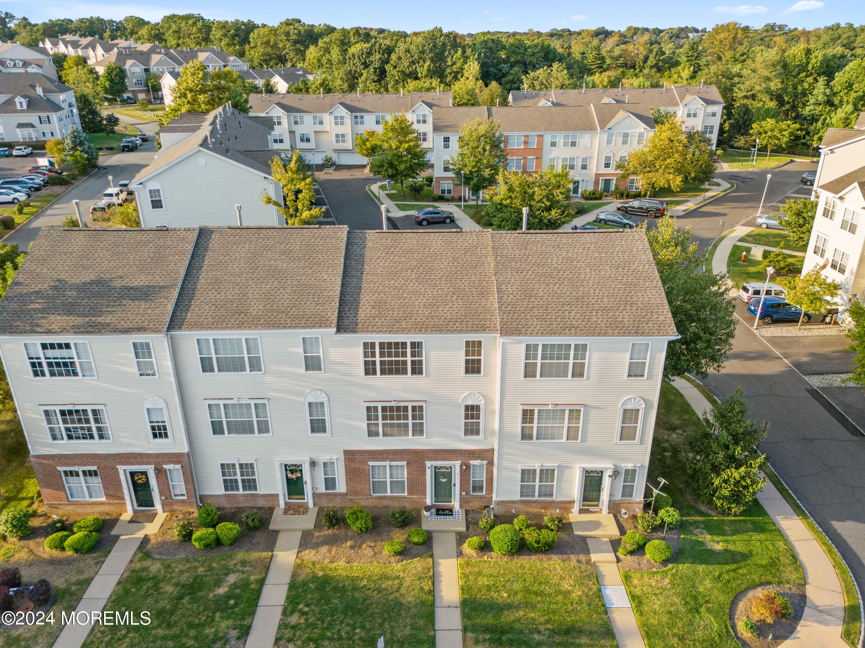 5 Kuczynski Drive, Unit 945 Parlin, NJ 08859 - Photo 45 of 62 aerial view of a house with a yard and plants