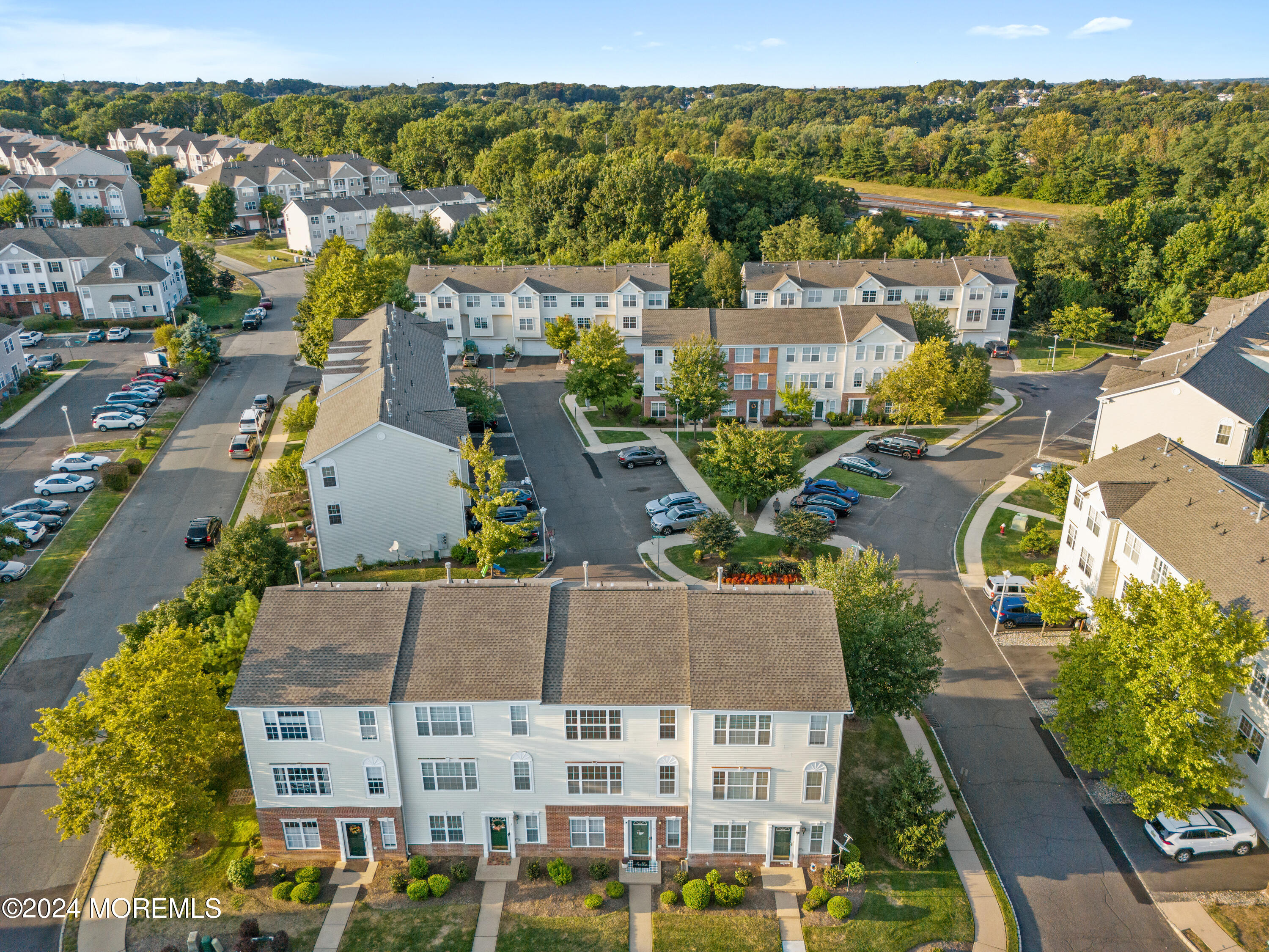 5 Kuczynski Drive, Unit 945 Parlin, NJ 08859 - Photo 49 of 62 an aerial view of residential houses with outdoor space
