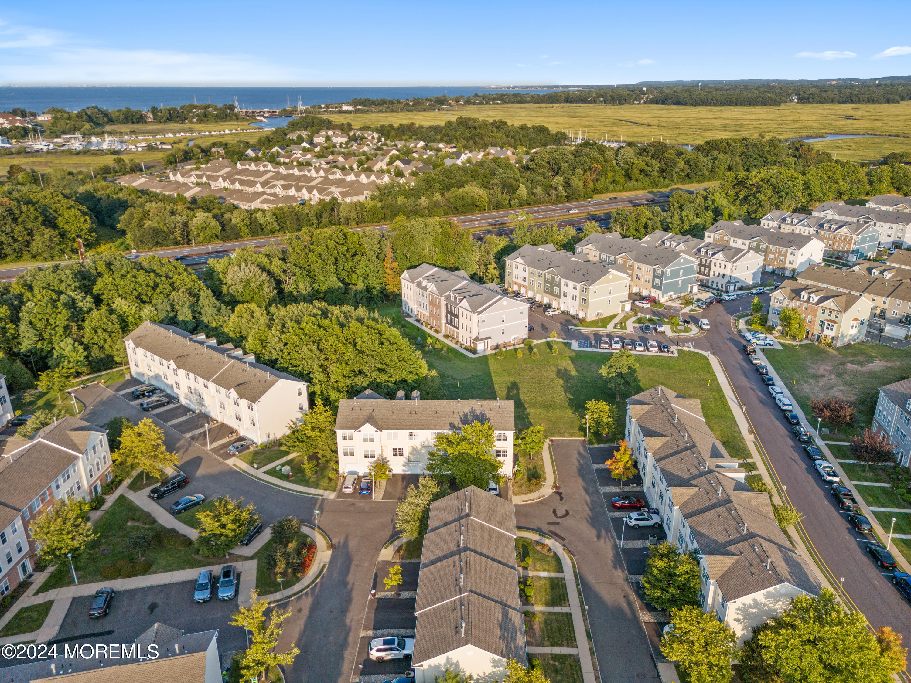 5 Kuczynski Drive, Unit 945 Parlin, NJ 08859 - Photo 57 of 62 an aerial view of residential building and lake