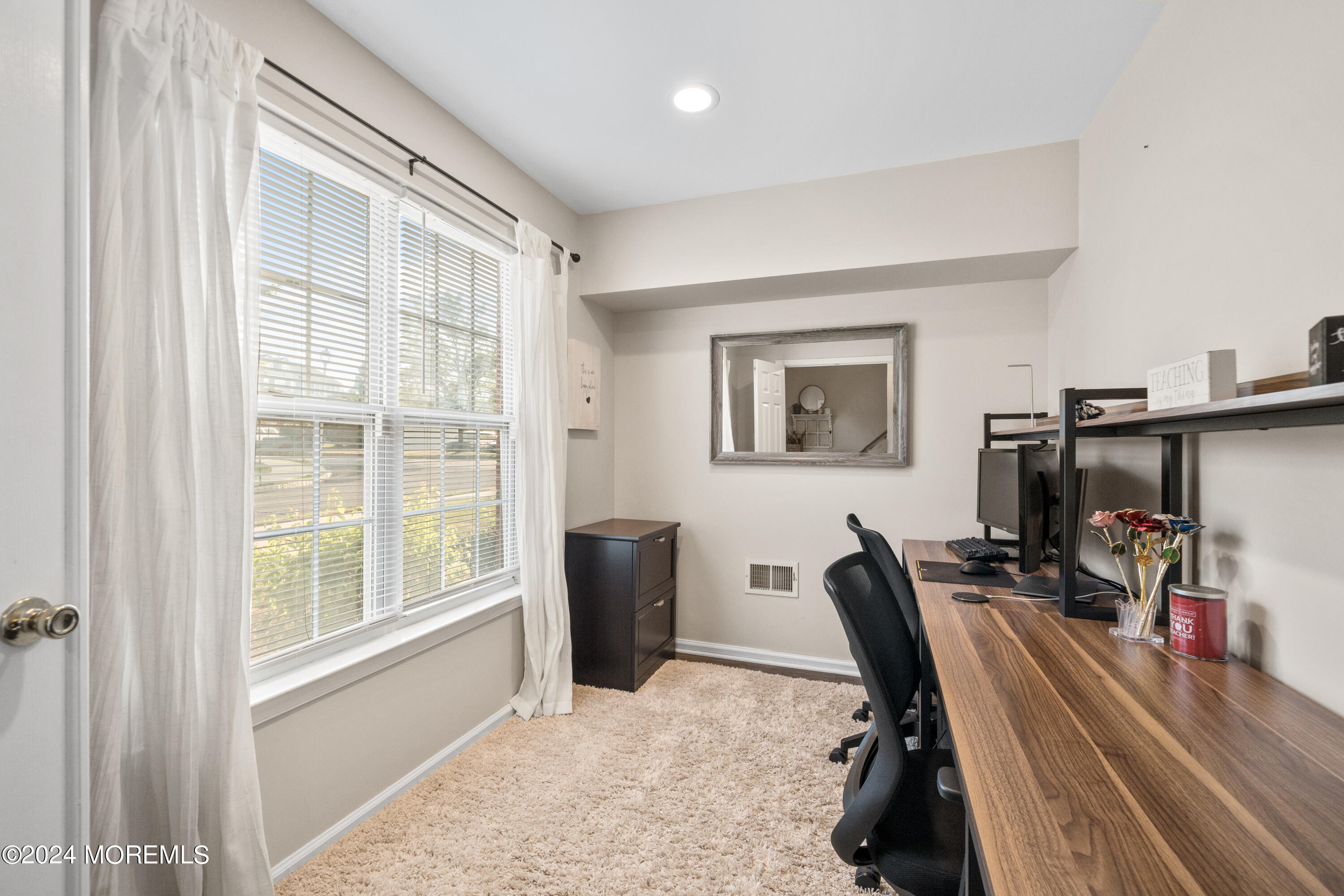 5 Kuczynski Drive, Unit 945 Parlin, NJ 08859 - Photo 7 of 62 a view of a workspace with furniture and a window