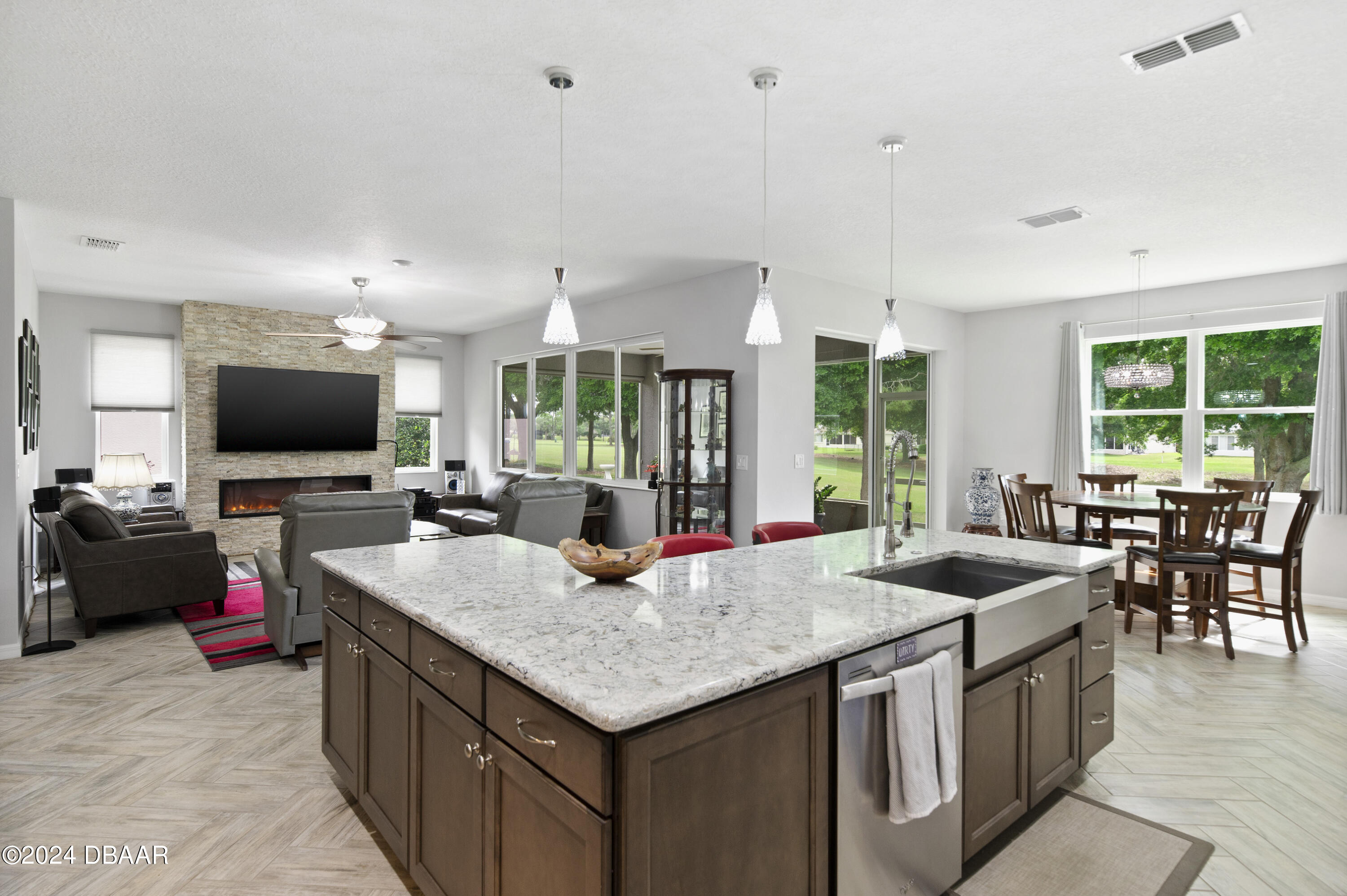 9794 Southwest 92 Street Ocala, FL 34481 - Photo 17 of 39 a kitchen with granite countertop a stove and a sink