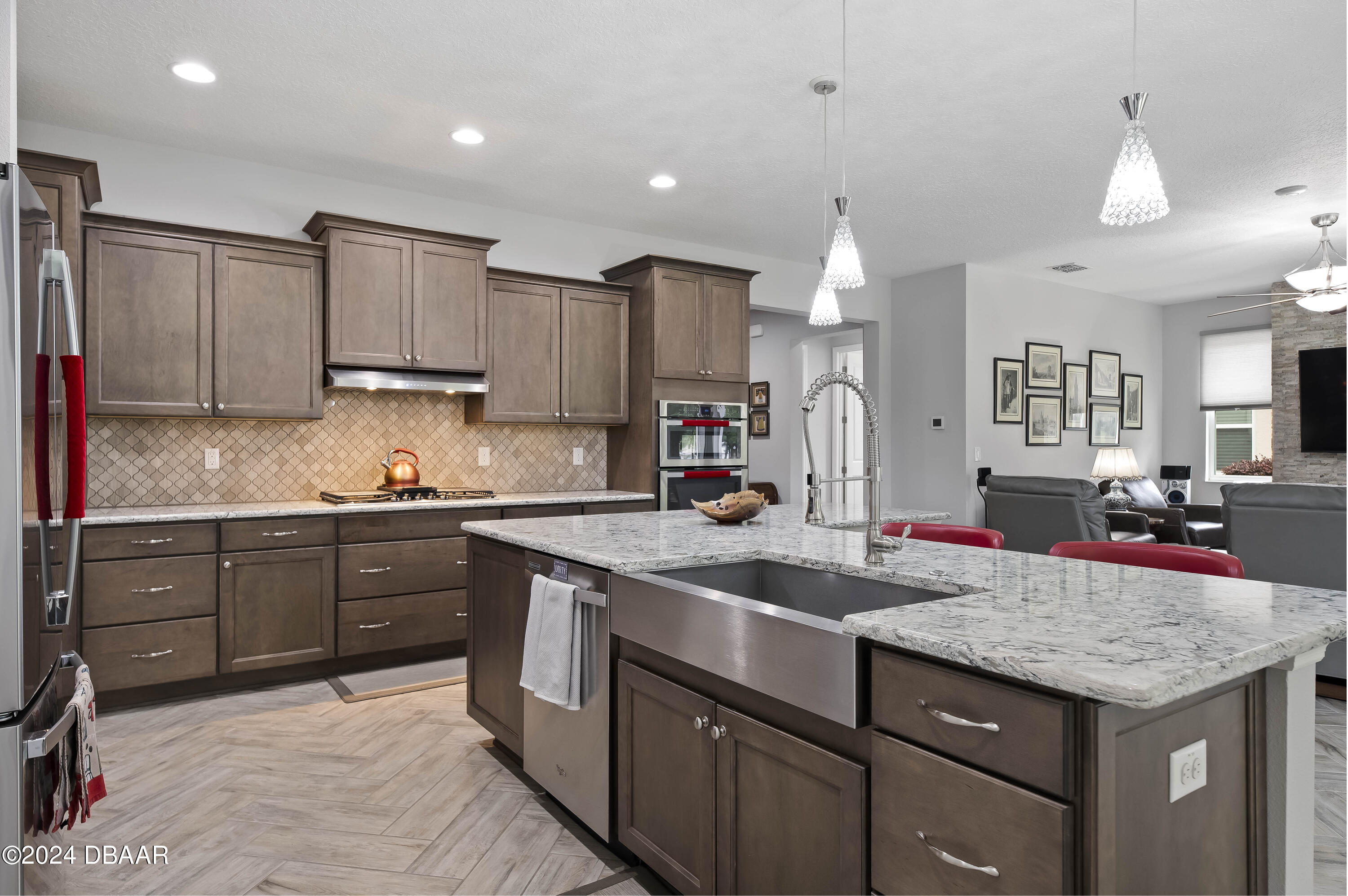 9794 Southwest 92 Street Ocala, FL 34481 - Photo 21 of 39 a kitchen with kitchen island granite countertop a sink stainless steel appliances and cabinets