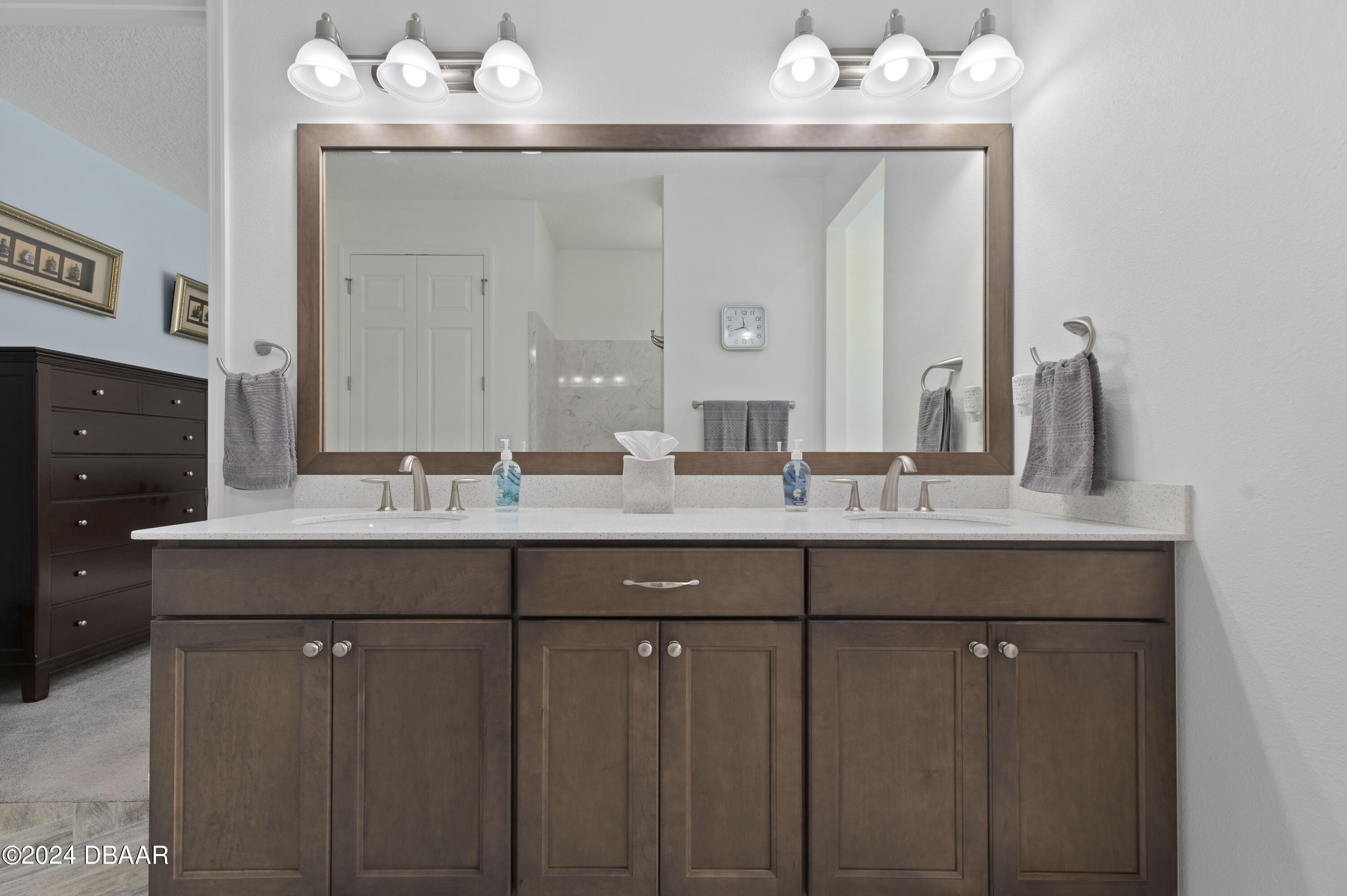 9794 Southwest 92 Street Ocala, FL 34481 - Photo 29 of 39 a bathroom with double vanity and a mirror