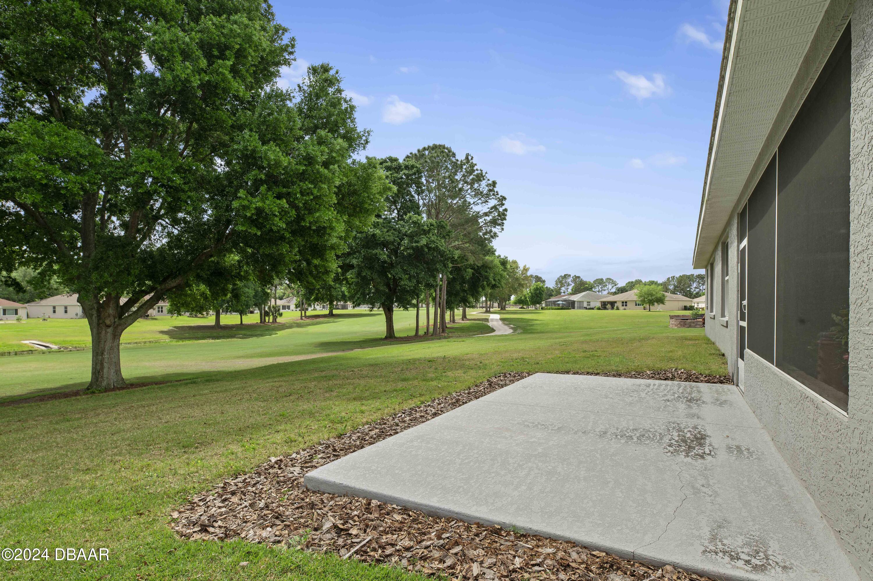 9794 Southwest 92 Street Ocala, FL 34481 - Photo 37 of 39 a view of a garden with an trees