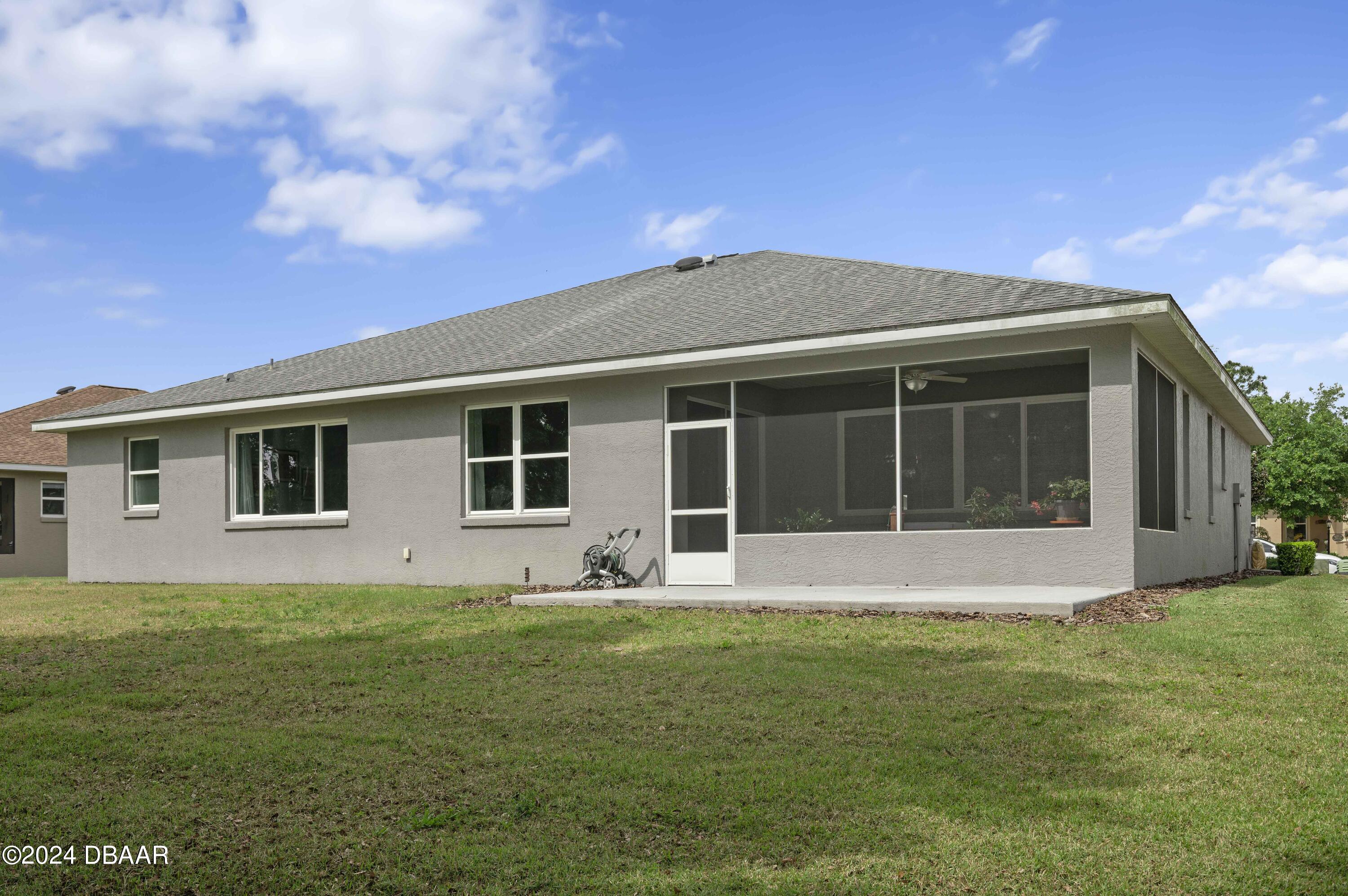 9794 Southwest 92 Street Ocala, FL 34481 - Photo 38 of 39 a front view of house with yard