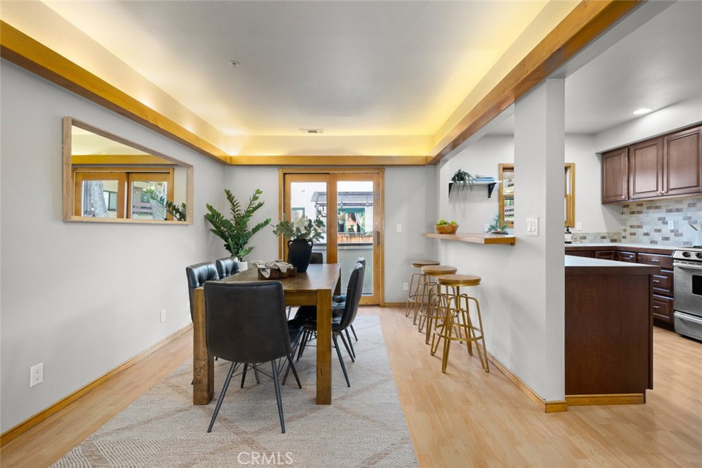 670 Chorro Street, Unit D San Luis Obispo, CA 93401 - Photo 13 of 40 a view of a dining room with furniture window and wooden floor