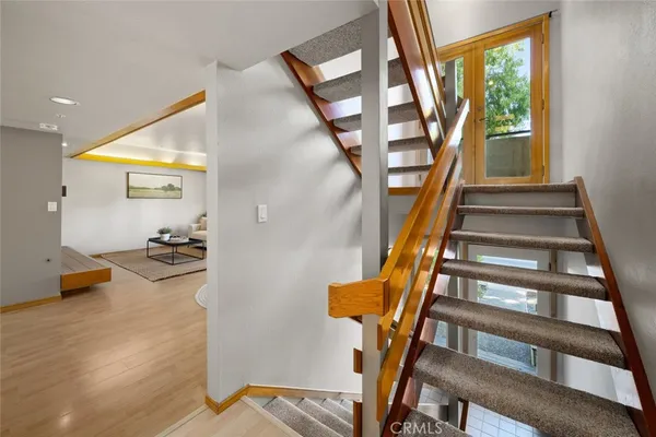 a view of staircase with furniture and staircase