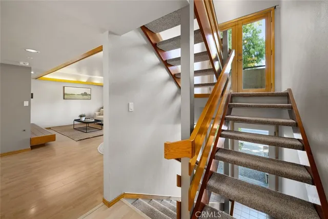 a view of staircase with furniture and staircase