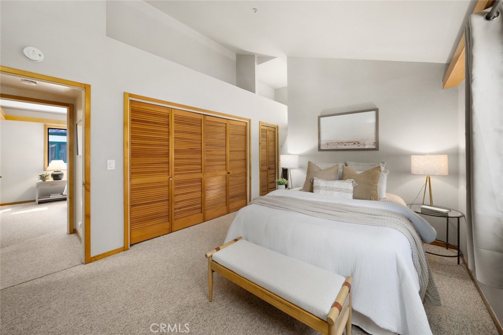 670 Chorro Street, Unit D San Luis Obispo, CA 93401 - Photo 25 of 40 a bedroom with a bed and a view mirror