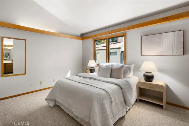 a bedroom with a bed and a desk