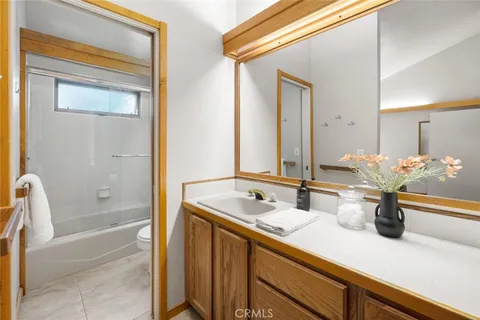 a bathroom with a shower and toilet