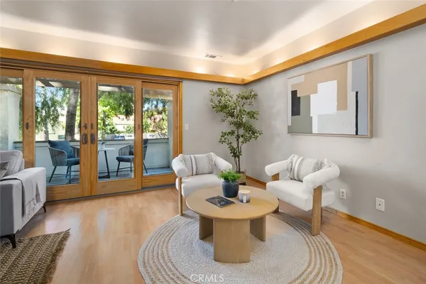 a living room with furniture and a large window