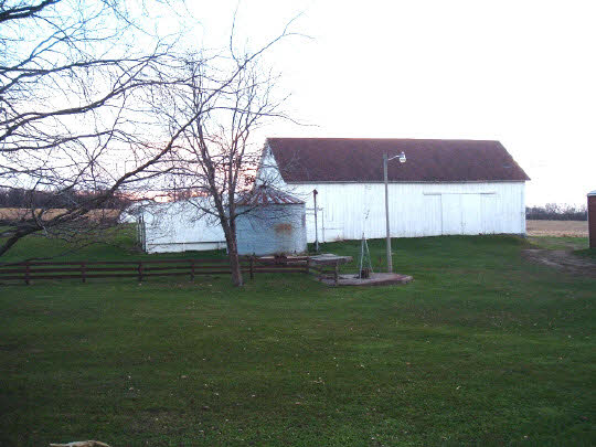 15568 Yale Bridge Road Durand, IL 61024 - Photo 1 of 5 a backyard of a house with table and chairs