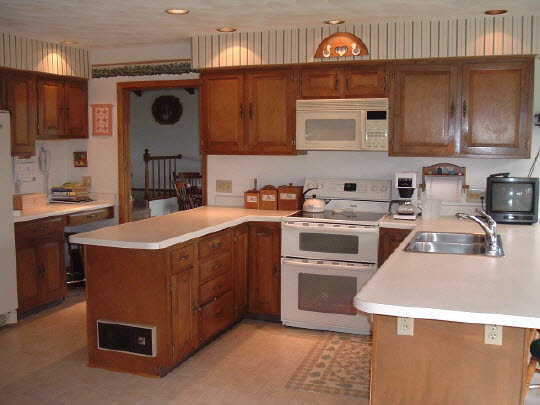 15568 Yale Bridge Road Durand, IL 61024 - Photo 3 of 5 a kitchen with stainless steel appliances granite countertop a stove a sink and a microwave