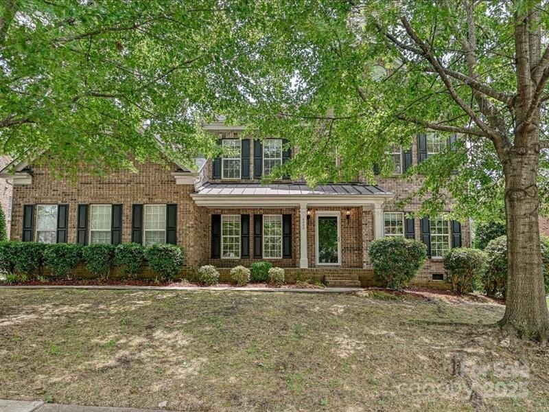6932 Augustine Way Charlotte, NC 28270 - Photo 1 of 46 a front view of a house with garden