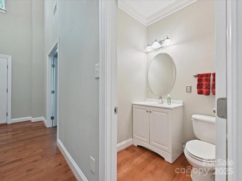 6932 Augustine Way Charlotte, NC 28270 - Photo 13 of 46 a bathroom with a toilet a sink and mirror