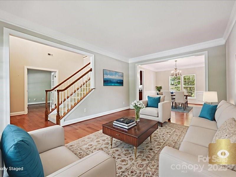 6932 Augustine Way Charlotte, NC 28270 - Photo 18 of 46 a living room with furniture and a table