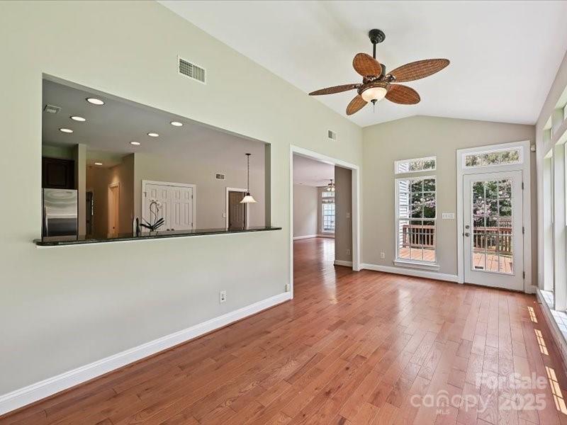 6932 Augustine Way Charlotte, NC 28270 - Photo 22 of 46 a view of an empty room with wooden floor and a window