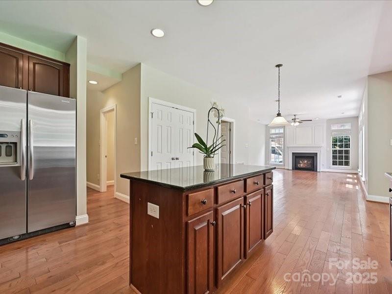 6932 Augustine Way Charlotte, NC 28270 - Photo 26 of 46 a kitchen with stainless steel appliances granite countertop a refrigerator a sink and a stove