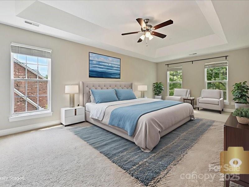 6932 Augustine Way Charlotte, NC 28270 - Photo 30 of 46 a bedroom with a large bed chandelier and a window