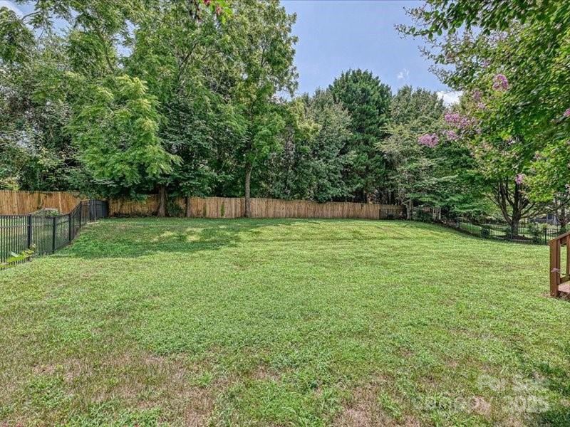 6932 Augustine Way Charlotte, NC 28270 - Photo 42 of 46 a view of a backyard with a small cabin
