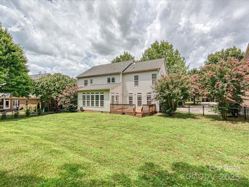 6932 Augustine Way Charlotte, NC 28270 - Photo 43 of 46 a view of a house with a big yard and a large tree