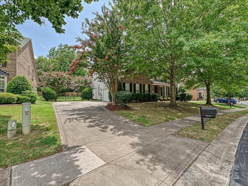 6932 Augustine Way Charlotte, NC 28270 - Photo 45 of 46 a front view of a house with garden