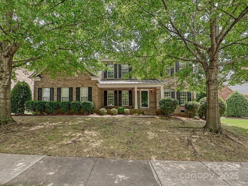 6932 Augustine Way Charlotte, NC 28270 - Photo 46 of 46 a front view of a house with a yard
