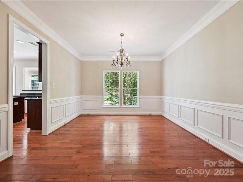 6932 Augustine Way Charlotte, NC 28270 - Photo 9 of 46 wooden floor in an empty room with a window