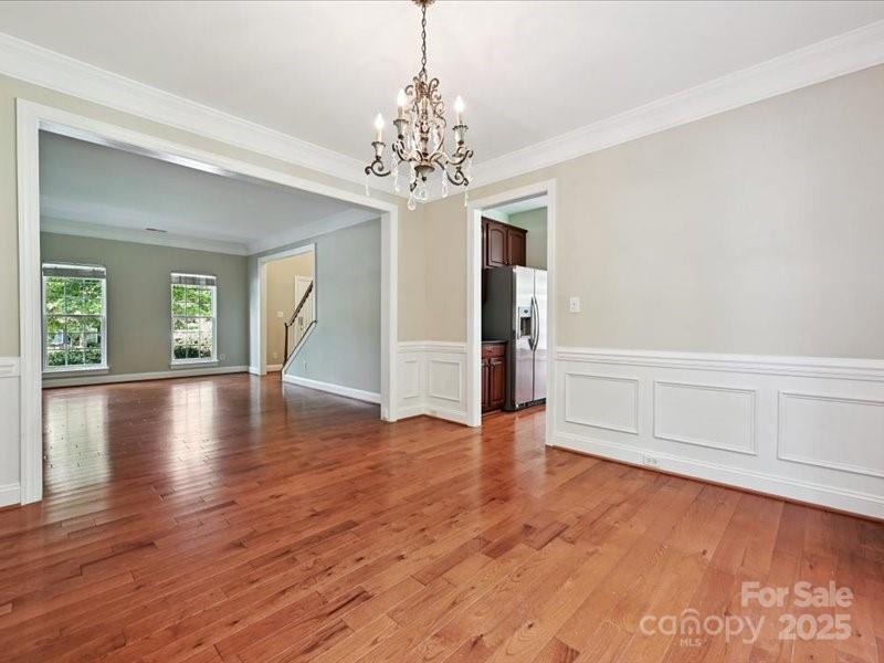 6932 Augustine Way Charlotte, NC 28270 - Photo 10 of 46 wooden floor in an empty room with a window