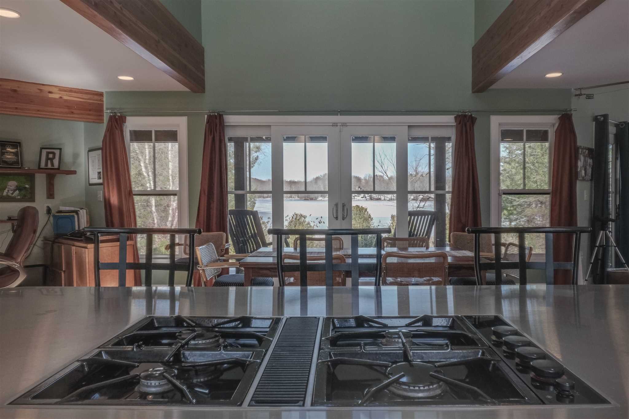 209 Lake Road Pine Plains, NY 12567 - Photo 12 of 34 a kitchen with wooden floor and stainless steel appliances