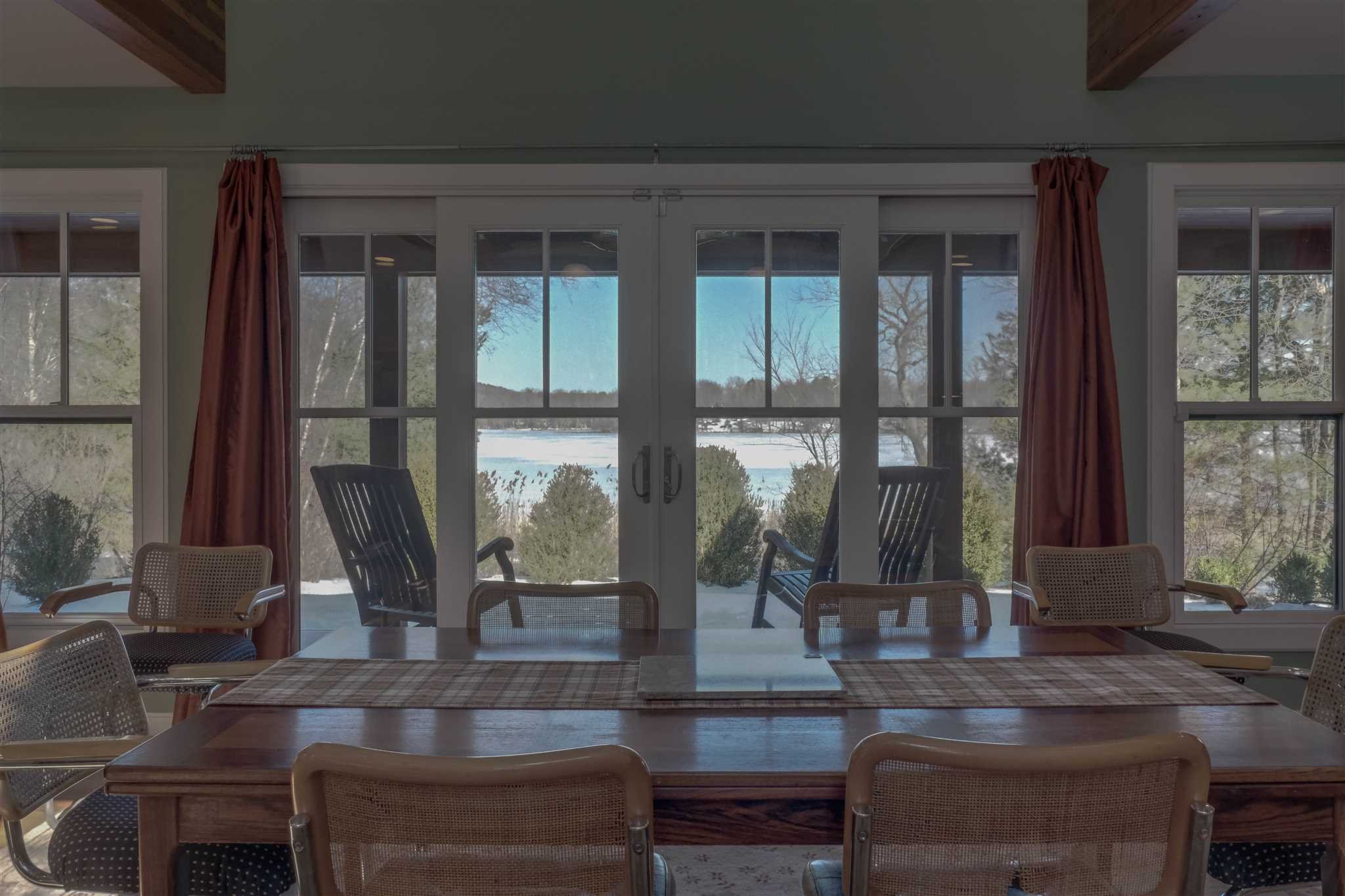 209 Lake Road Pine Plains, NY 12567 - Photo 13 of 34 a living room with couches and a large window with garden view