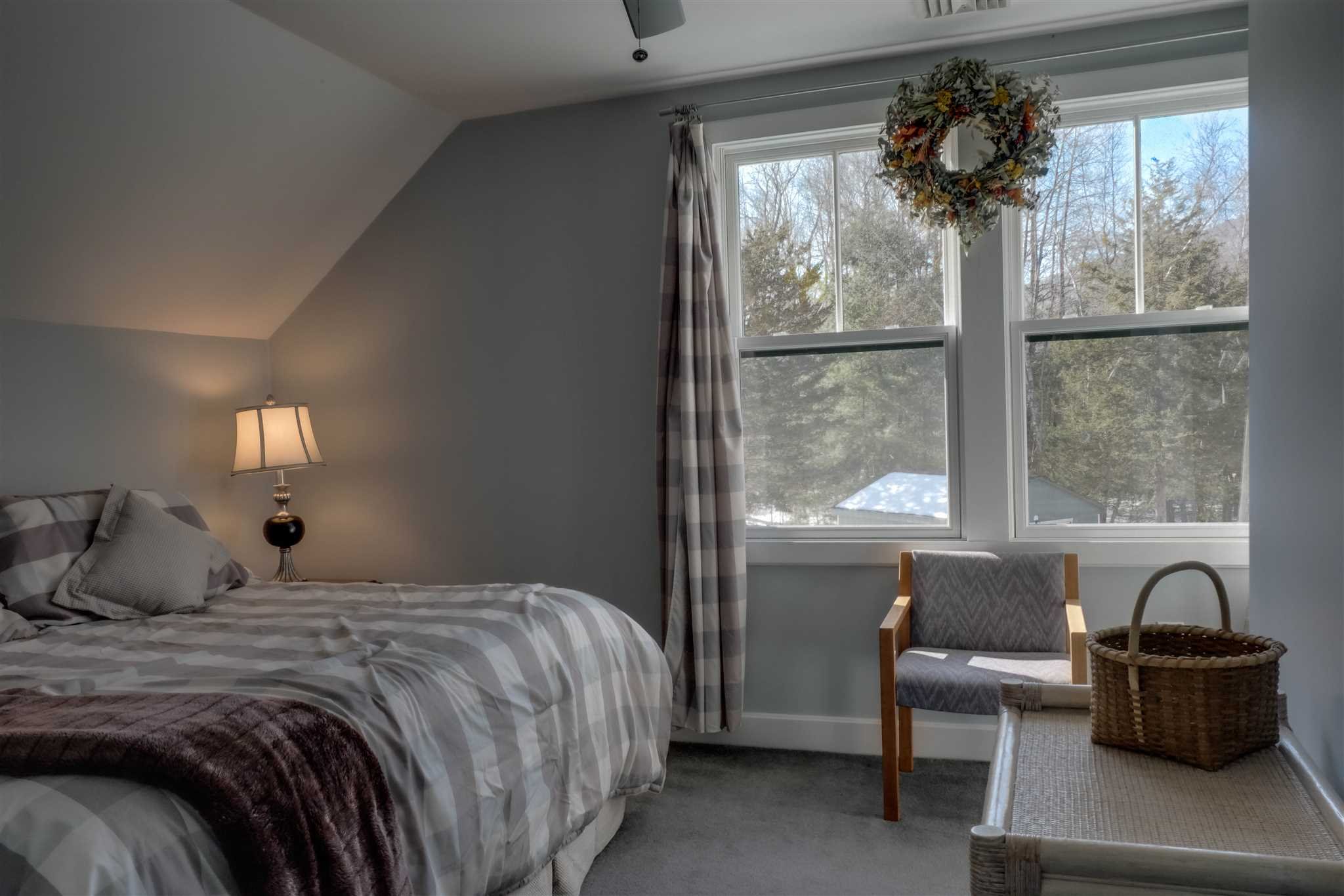 209 Lake Road Pine Plains, NY 12567 - Photo 23 of 34 a bedroom with a balcony a bed and a large window