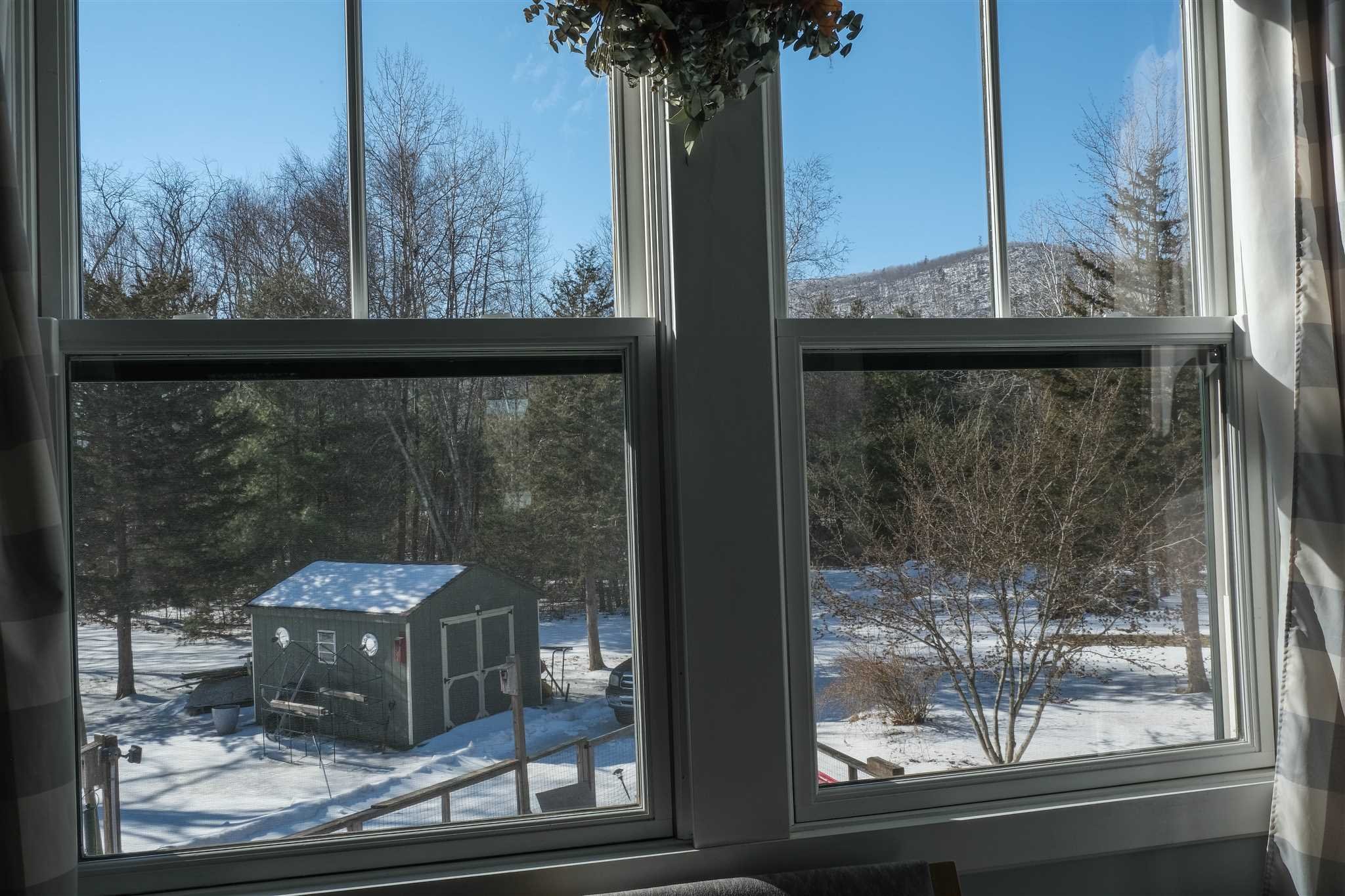 209 Lake Road Pine Plains, NY 12567 - Photo 25 of 34 a view of a glass door with a tree