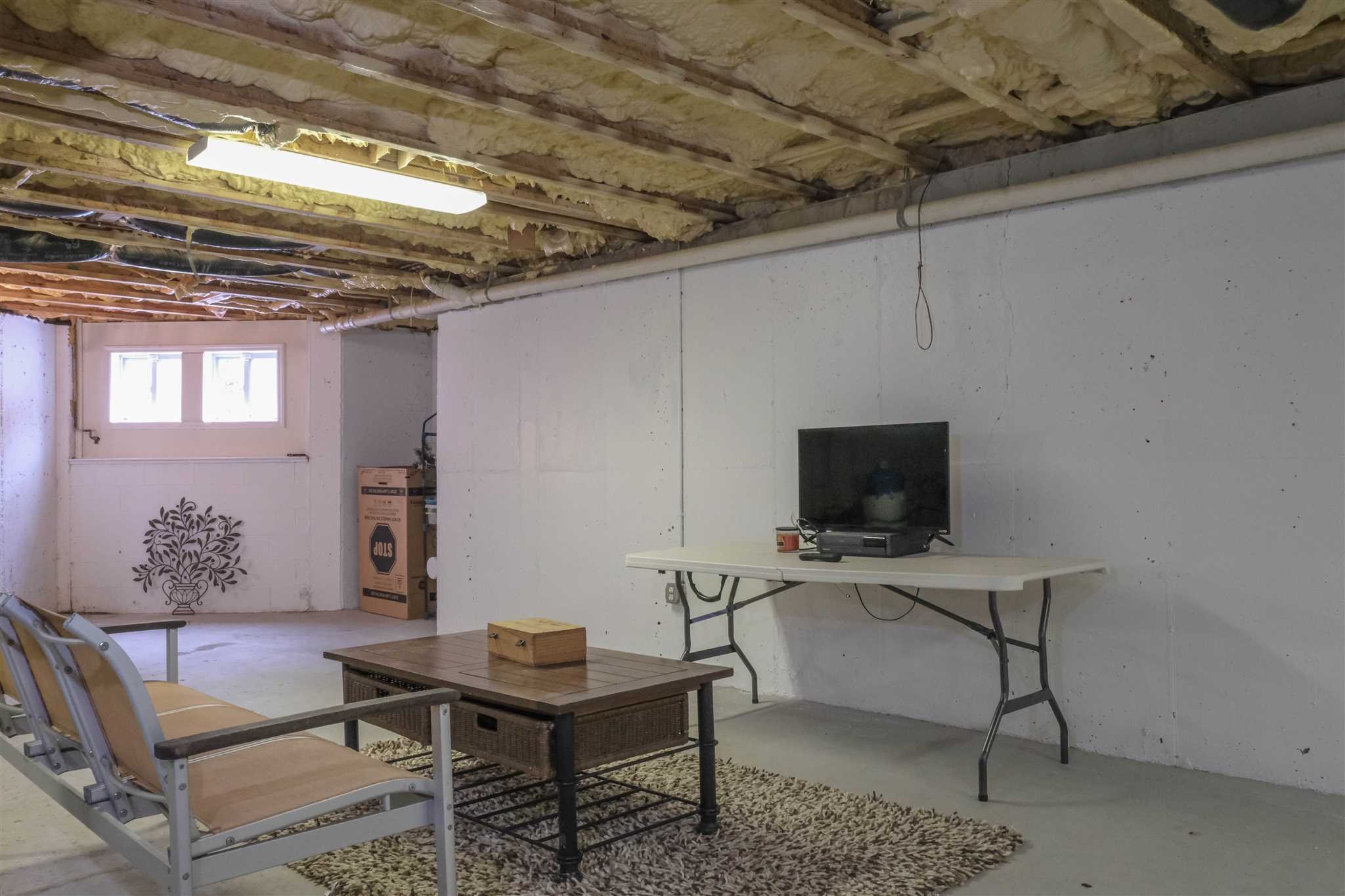 209 Lake Road Pine Plains, NY 12567 - Photo 30 of 34 a living room with furniture and a flat screen tv