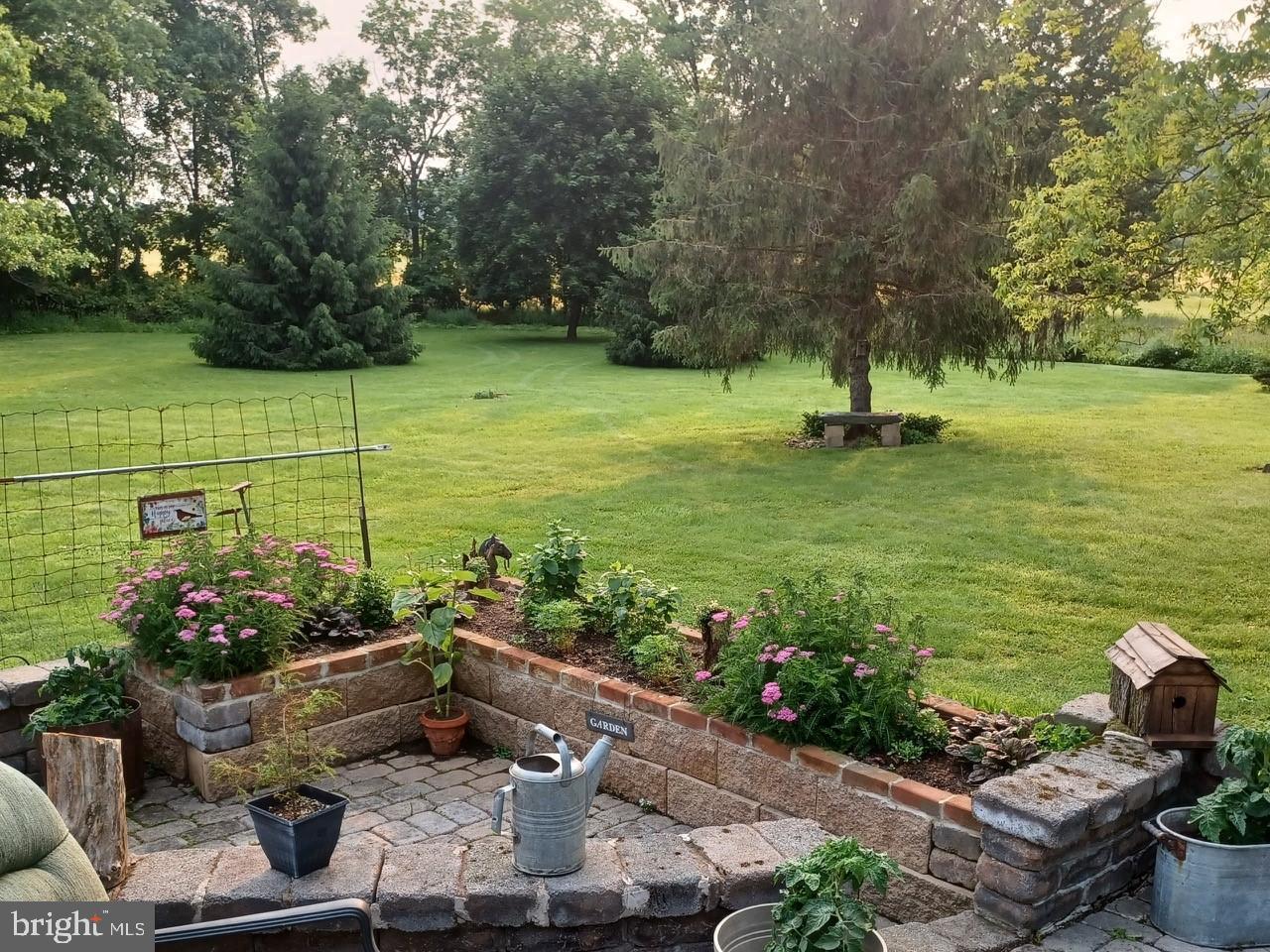 13433 Kretsinger Road Smithsburg, MD 21783 - Photo 54 of 57 Serene garden retreat with lush greenery.