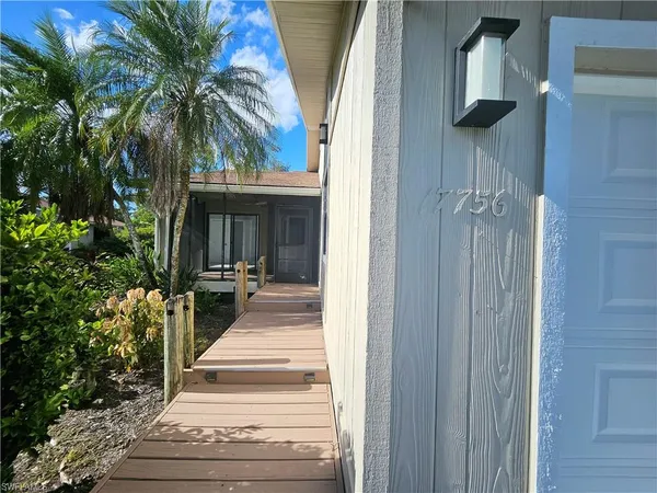 a view of a house with a potted plant and a potted plant