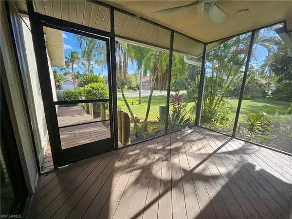 a view of a porch and garden