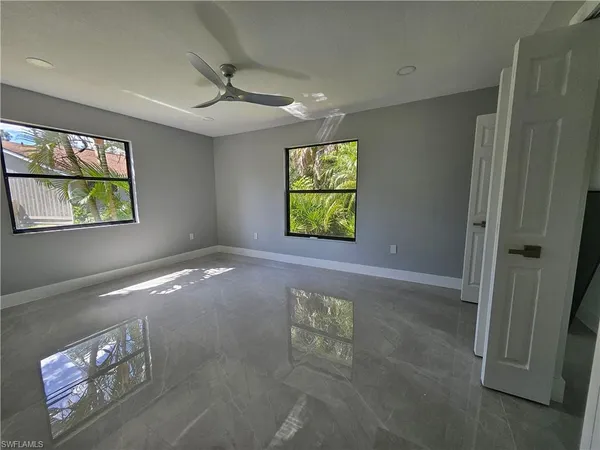 a view of an empty room with a window