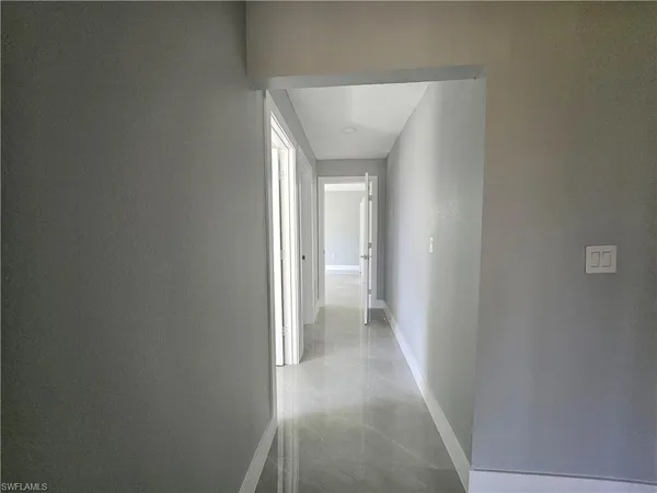 a view of a hallway with a white walls