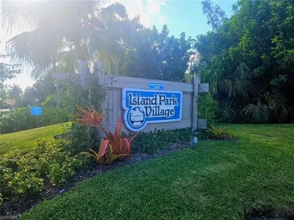 a sign that is sitting in the grass