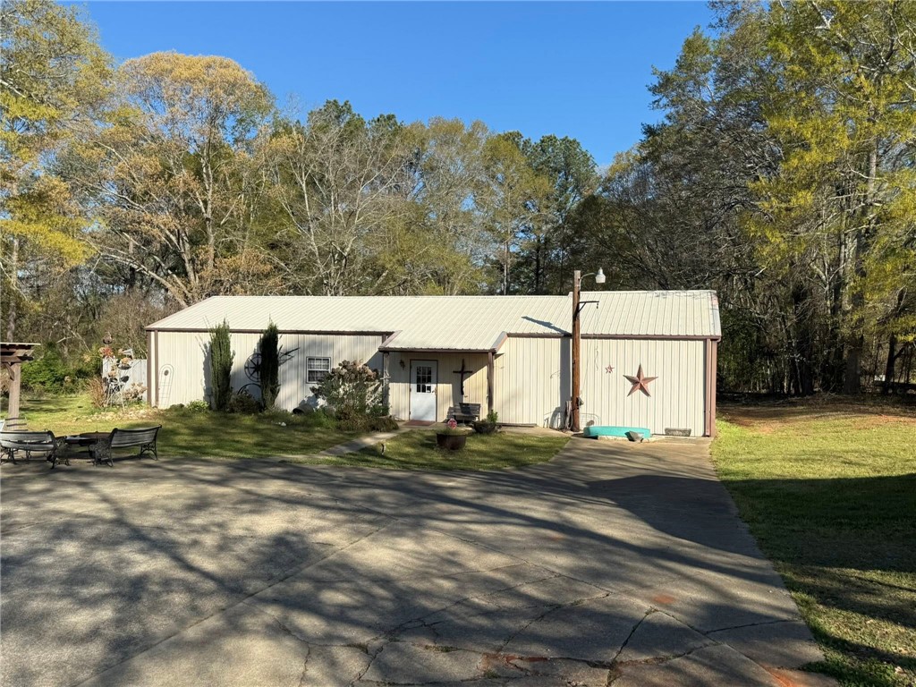 4027 Belhaven Road Belton, SC 29627 - Photo 3 of 24 A charming country residence with a wide driveway and natural surroundings.