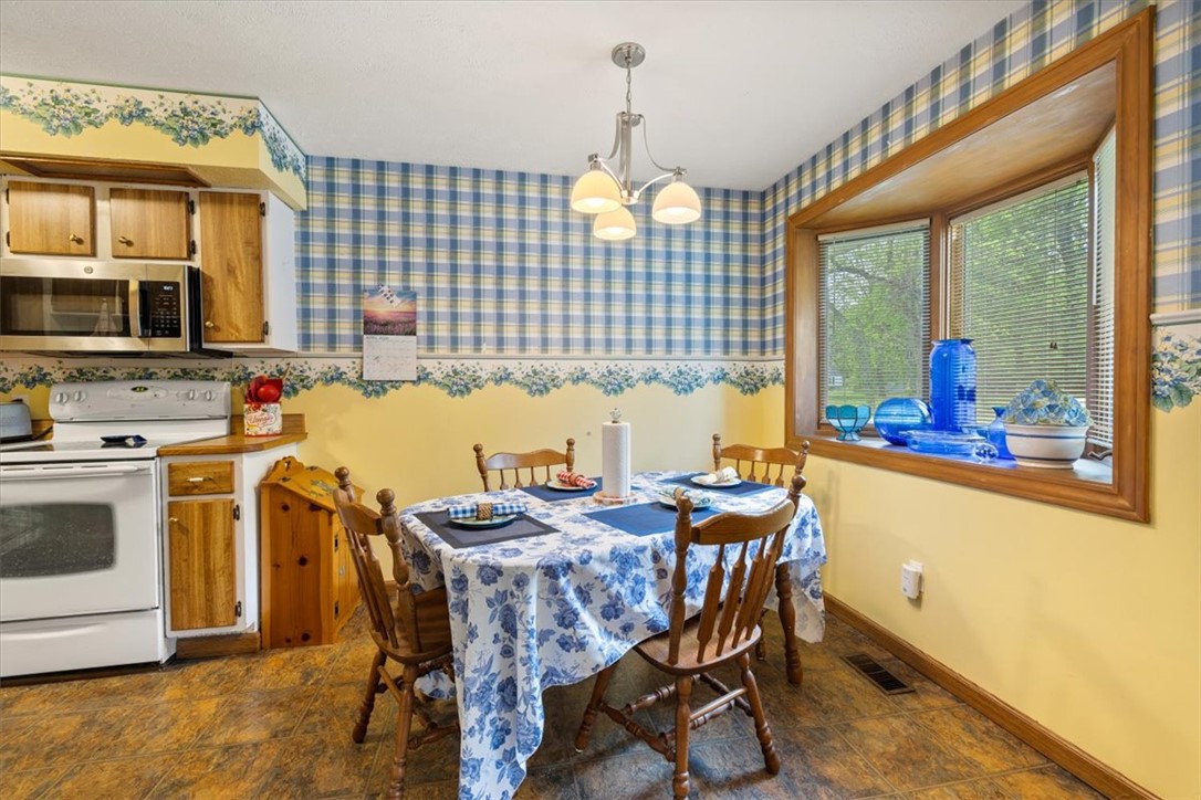 7225 Garber Road Clayton, OH 45415 - Photo 23 of 33 This inviting dining area features a large window for natural light.